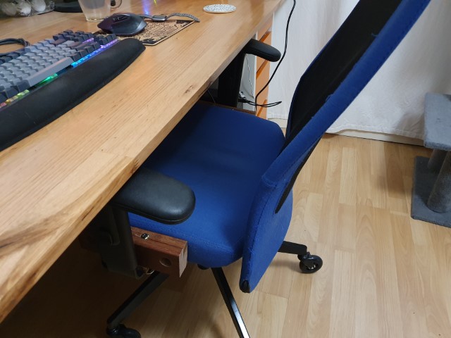 Chair tucked in to desk