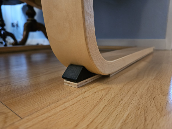The base of an IKEA Poäng chair, with a layer of plywood discreetly attached underneath