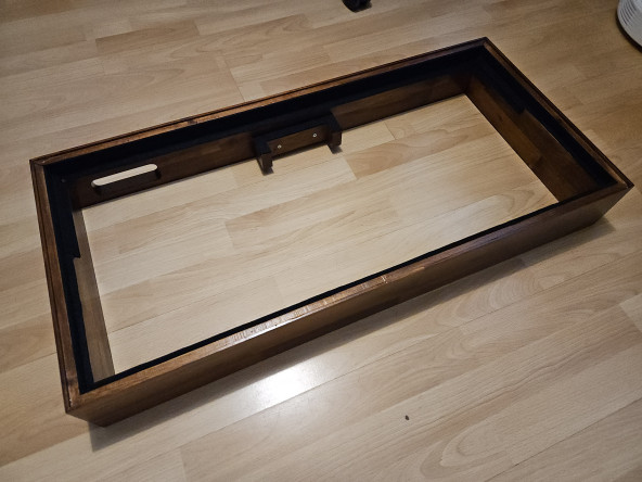 The frame, with felt tape around the edges, ready to have the monitor put in